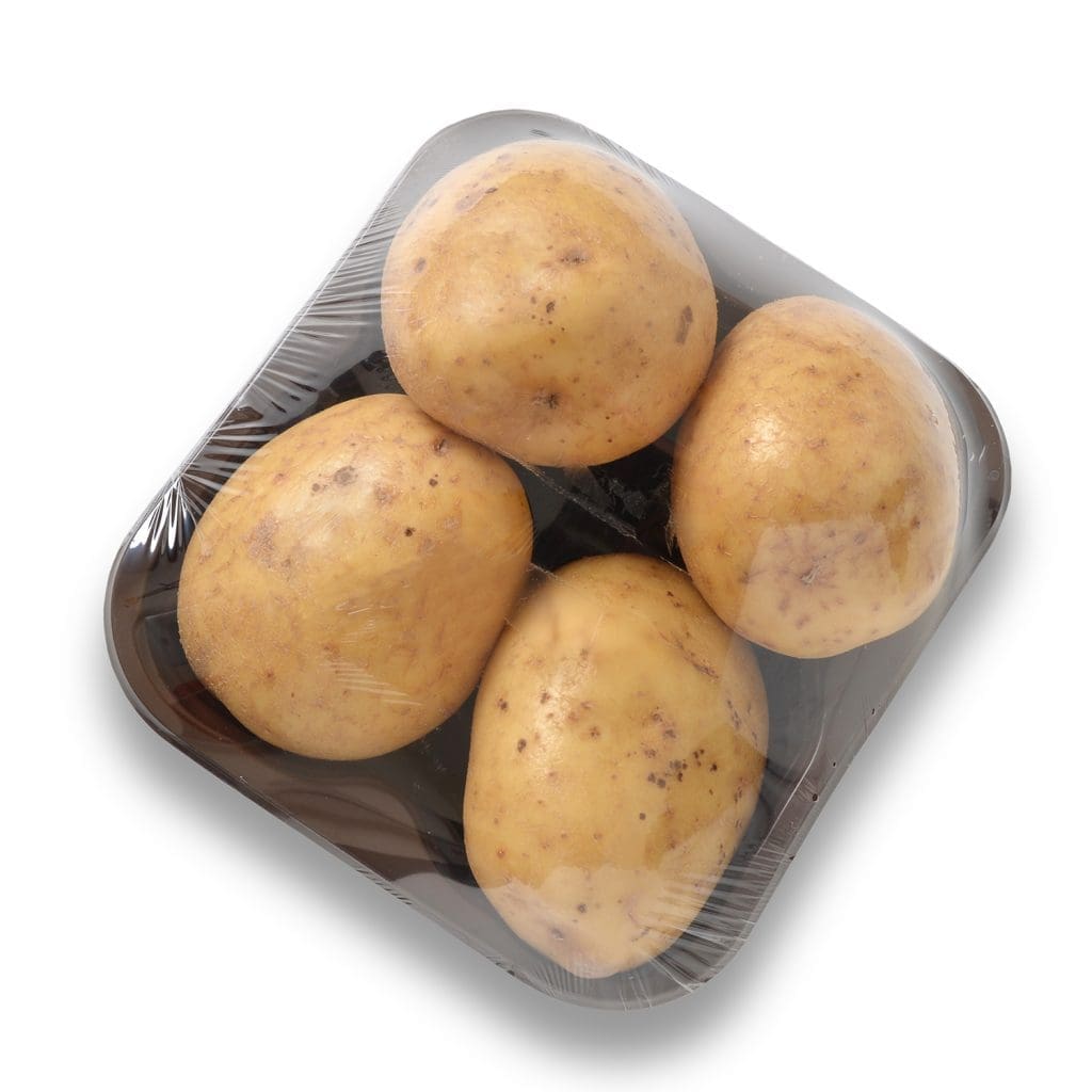 A shrink-wrapped package of multiple potatoes