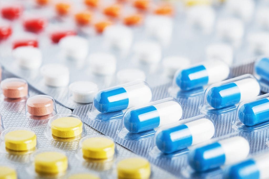 pill packaging with all different types of pills within them