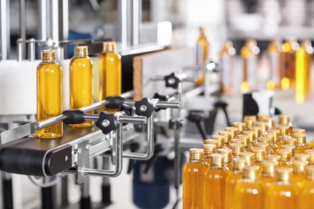 Brown glass bottles on a production line