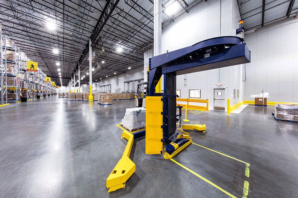 Semi-Automatic Pallet Wrapper machine inside warehouse.